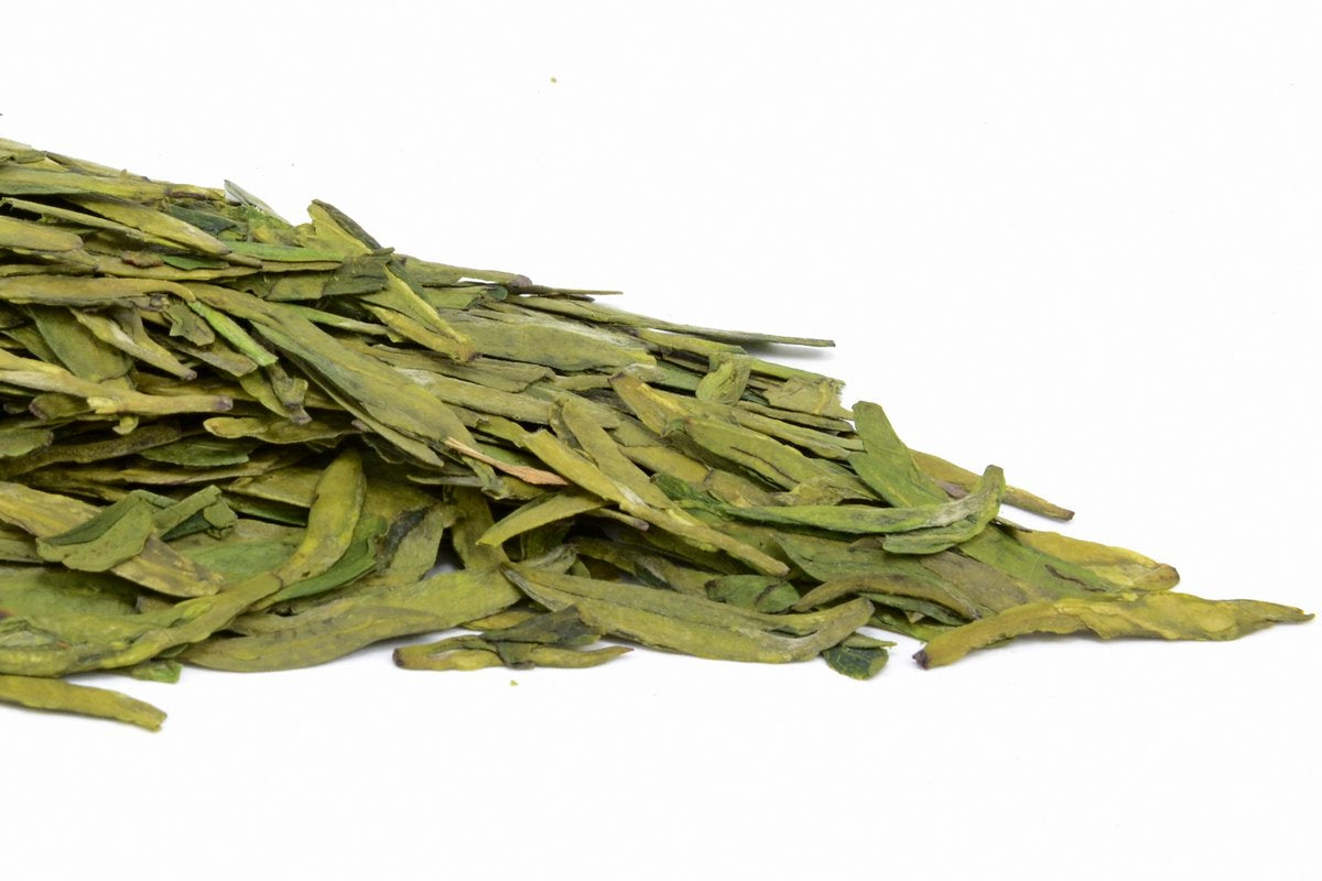 Premium Long Jing Chinese green tea with flat hand-fired leaves and golden infusion